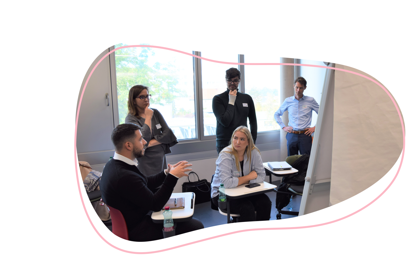 People discussing in a classroom.